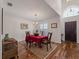 Formal dining room with hardwood floors and red tablecloth at 1981 Bayshore Dr, Englewood, FL 34223