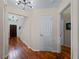 Light and airy entryway with wood floors and staircase at 1981 Bayshore Dr, Englewood, FL 34223