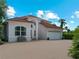 Two-story house with brick driveway and tile roof at 1981 Bayshore Dr, Englewood, FL 34223