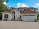 Two-story house with brick driveway and tile roof at 1981 Bayshore Dr, Englewood, FL 34223