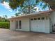 Detached garage with double doors and brick pavers at 1981 Bayshore Dr, Englewood, FL 34223