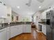 Modern kitchen with granite countertops and tile floors at 1981 Bayshore Dr, Englewood, FL 34223