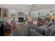 Cozy living room featuring a fireplace and hardwood floors at 1981 Bayshore Dr, Englewood, FL 34223