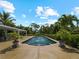 Large pool with spa and tropical landscaping at 1981 Bayshore Dr, Englewood, FL 34223