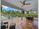 Relaxing screened porch overlooking the pool and lush landscaping at 1981 Bayshore Dr, Englewood, FL 34223