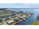 Wide shot of waterfront community with houses and canals at 210 Beeney Se Rd, Port Charlotte, FL 33952