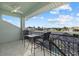 Balcony with water view and small table and chairs at 210 Beeney Se Rd, Port Charlotte, FL 33952