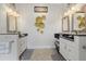 Elegant double vanity bathroom with modern fixtures at 210 Beeney Se Rd, Port Charlotte, FL 33952