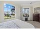 Bedroom with large window offering scenic water views at 210 Beeney Se Rd, Port Charlotte, FL 33952