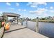 Private boat dock with covered seating and kayak storage at 210 Beeney Se Rd, Port Charlotte, FL 33952