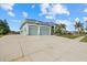 Three-car garage and spacious driveway at 210 Beeney Se Rd, Port Charlotte, FL 33952