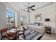 Bright guest room featuring a daybed, seating area, and large windows at 210 Beeney Se Rd, Port Charlotte, FL 33952