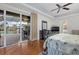 Main bedroom with pool view and hardwood floors at 210 Beeney Se Rd, Port Charlotte, FL 33952