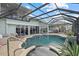 Enclosed pool and spa with patio furniture at 210 Beeney Se Rd, Port Charlotte, FL 33952