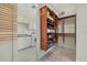 Large walk-in closet with custom shelving at 210 Beeney Se Rd, Port Charlotte, FL 33952