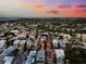 Aerial view of a beach town home with sunset in the background at 221 Tenacity Ln, Sarasota, FL 34242