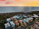 Aerial view of beach house at sunset, highlighting its location at 221 Tenacity Ln, Sarasota, FL 34242