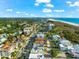 Beachfront home; aerial view; ocean nearby at 221 Tenacity Ln, Sarasota, FL 34242