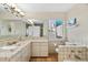 Bathroom with a double vanity and tiled floors at 221 Tenacity Ln, Sarasota, FL 34242