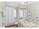 Charming bathroom with seashell accents and a tub shower combo at 221 Tenacity Ln, Sarasota, FL 34242