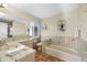 Bathroom with tile shower, bathtub and tiled floors at 221 Tenacity Ln, Sarasota, FL 34242