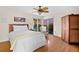 Bedroom with queen bed, water view, and ceiling fan at 221 Tenacity Ln, Sarasota, FL 34242