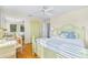 Guest bedroom with light green bed frame and hardwood floors at 221 Tenacity Ln, Sarasota, FL 34242