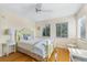 Bedroom with hardwood floors and light green bed frame at 221 Tenacity Ln, Sarasota, FL 34242