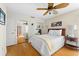 Bedroom with mirrored closet doors and ceiling fan at 221 Tenacity Ln, Sarasota, FL 34242