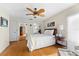 Bright bedroom with a queen-size bed and mirrored closet doors at 221 Tenacity Ln, Sarasota, FL 34242