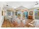 Open dining area with patio access and chandelier at 221 Tenacity Ln, Sarasota, FL 34242