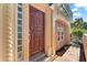 Inviting front entrance with a rich wood door and stone pathway at 221 Tenacity Ln, Sarasota, FL 34242