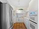 Modern kitchen with stainless steel appliances and tile flooring at 221 Tenacity Ln, Sarasota, FL 34242