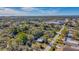 Aerial view showing a neighborhood with lush trees and nearby waterfront at 2338 Lynn St, Sarasota, FL 34231