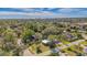 Aerial view of a single-Gathering home with a large yard and surrounding neighborhood at 2338 Lynn St, Sarasota, FL 34231