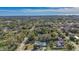 Aerial view of a residential area with mature trees and a coastal view at 2338 Lynn St, Sarasota, FL 34231