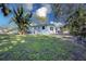 Spacious backyard with lush grass and mature trees at 2338 Lynn St, Sarasota, FL 34231