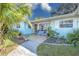 Pathway leading to the entrance of a charming light blue house at 2338 Lynn St, Sarasota, FL 34231