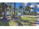 House with a well-manicured lawn and palm trees at 2338 Lynn St, Sarasota, FL 34231