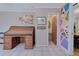 Home office features a vintage roll-top desk, built-in shelving, and an adjacent bathroom at 2338 Lynn St, Sarasota, FL 34231