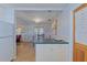 Kitchen with breakfast bar and view into dining area at 2338 Lynn St, Sarasota, FL 34231