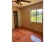 Bright bedroom with tile floors and a large closet at 2636 Hidden Lake N Dr # G, Sarasota, FL 34237