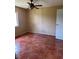 Condo bedroom with tiled floor and ceiling fan at 2636 Hidden Lake N Dr # G, Sarasota, FL 34237