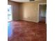 Condo bedroom with tiled floors and door to balcony at 2636 Hidden Lake N Dr # G, Sarasota, FL 34237