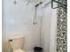 Simple bathroom with shower, toilet and a shower curtain at 315 Palm Grove Ave, Englewood, FL 34223