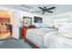 Main bedroom with king bed and kitchen view at 315 Palm Grove Ave, Englewood, FL 34223