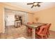 Casual dining area with rustic wooden table and chairs, adjacent to kitchen at 315 Palm Grove Ave, Englewood, FL 34223