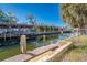 Steps leading to canal with boat slips at 315 Palm Grove Ave, Englewood, FL 34223