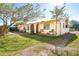 Charming single story home with a spacious front yard and covered porch at 315 Palm Grove Ave, Englewood, FL 34223