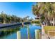 Scenic canal-front property with lush landscaping at 315 Palm Grove Ave, Englewood, FL 34223